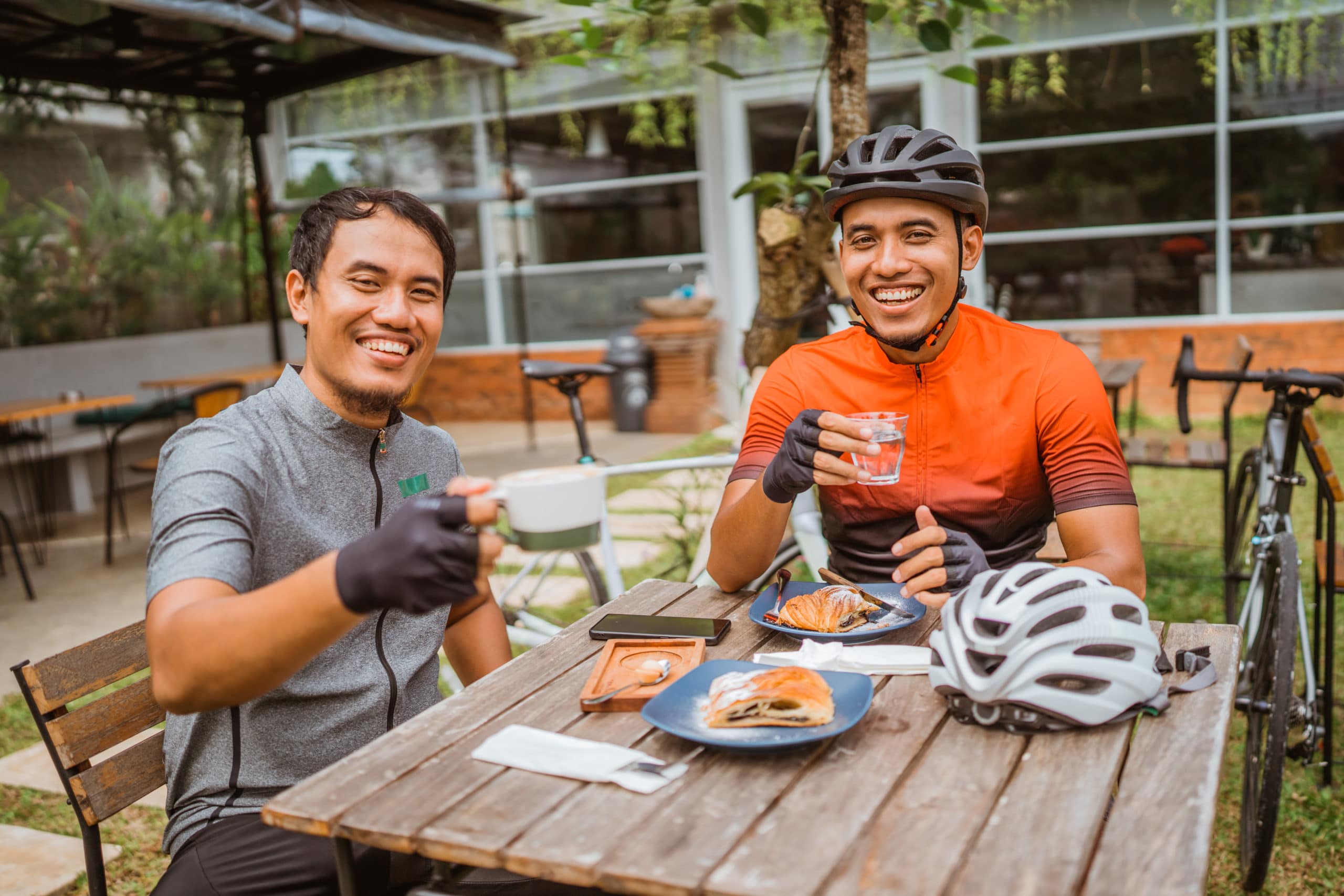 two-cyclist-enjoying-coffee-in-a-cafe-after-riding-eko-life-malaysia-banner