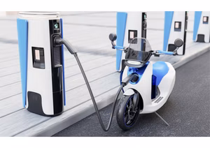 An electric scooter and e-scooter side by side on a city street.