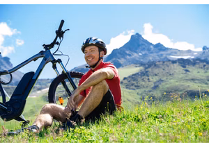 Person using tools to change a tire on an electric bike.