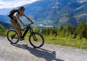 E-bike rider practicing braking techniques on a trail.
